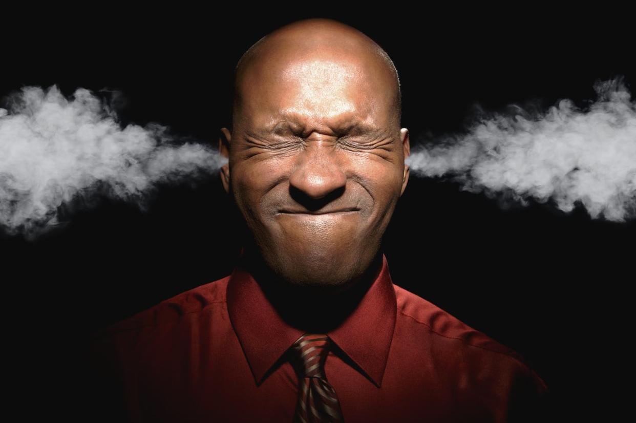 Racial stress can seriously threaten a person's well-being. <a href="https://www.gettyimages.com/detail/photo/african-man-with-eyes-closed-and-steam-coming-from-royalty-free-image/73232033?phrase=black%20stress&adppopup=true" rel="nofollow noopener" target="_blank" data-ylk="slk:John M Lund Photography Inc via Getty Images;elm:context_link;itc:0;sec:content-canvas" class="link ">John M Lund Photography Inc via Getty Images</a>