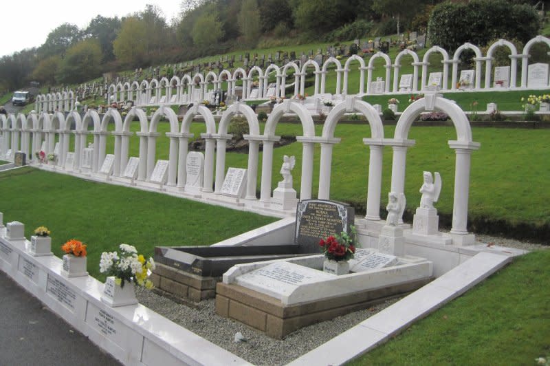 On October 21, 1966, an avalanche of coal slag cascaded down a Welsh mountainside, burying a school and killing 148 people, mostly young students, whose graves are marked with a series of arches. File Photo by Llywelyn2000/Wikimedia