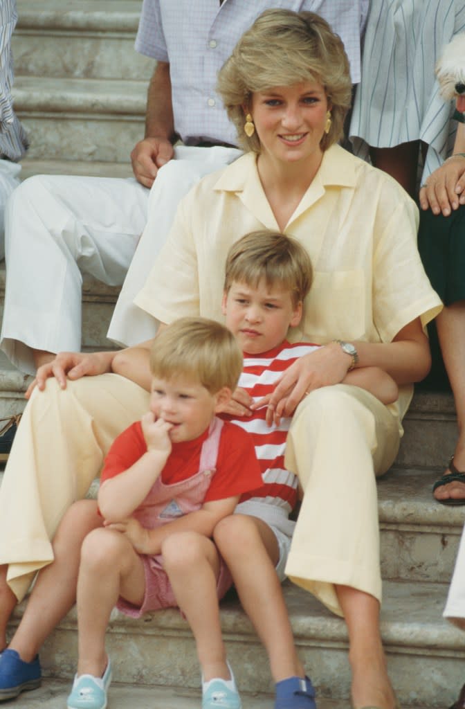 Princess Diana with Prince Harry and Prince William during a holiday with the Spanish royal family at the Marivent Palace in Palma de Mallorca, Spain, in Aug. 1987. Getty Images