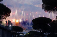 Fireworks illuminate the sky at the Olympic stadium during the inauguration ceremony held before the start of the Euro 2020 soccer championship group A match between Italy and Turkey, in Rome, Friday, June 11, 2021. (AP Photo/Riccardo De Luca)