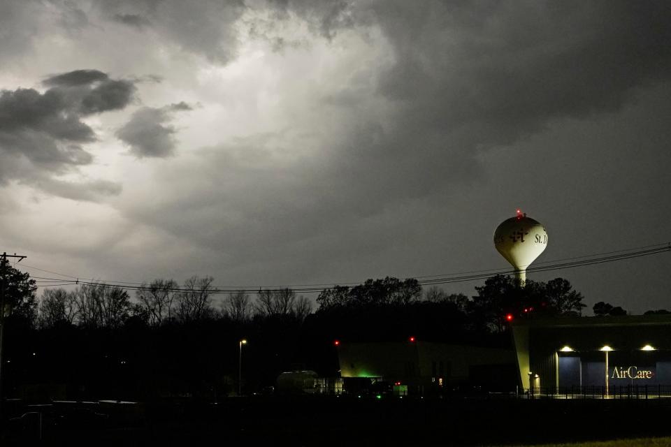 Lightning brightens the evening sky in Jackson, Mississippi, as severe weather accompanied by some potential twisters affected parts of Louisiana and Mississippi.