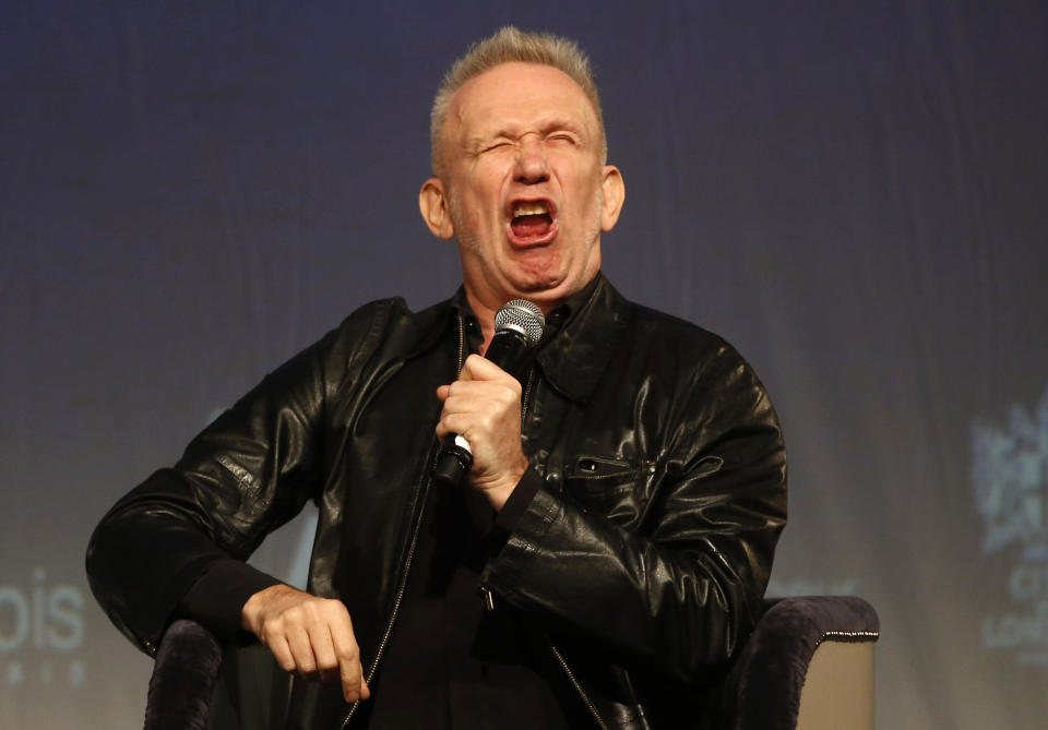 French couturier Jean Paul Gaultier pulls a face as he speaks to the media during a Q&A session during the launch his exhibition 'The Fashion World of Jean Paul Gaultier : From the Sidewalk to the Catwalk' at the Barbican Art Gallery in London, Tuesday, April 8, 2014. (AP Photo/Sang Tan)