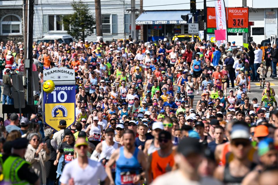 Runners make their way along Waverly Street during the 128th running of the Boston Marathon.