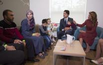 Prime Minister Justin Trudeau and his wife Sophie Gregoire Trudeau greet Syrian refugees Ahmad Al Krad, his wife Doaa Al Mahmed and his children Nasser, Panem and Muneer Ahmad at the Immigration Services Society in Vancouver, B.C., Sunday, Sept 25, 2016. THE CANADIAN PRESS/Jonathan Hayward