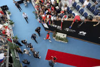 Serbia's Novak Djokovic signs autographs after defeating France's Quentin Halys during their Round of 16 match at the Adelaide International Tennis tournament in Adelaide, Australia, Thursday, Jan. 5, 2023. (AP Photo/Kelly Barnes)