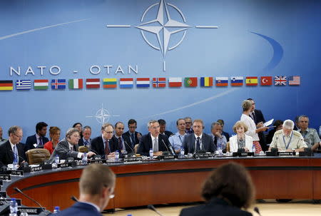 NATO Secretary General Jens Stoltenberg (C) addresses the North Atlantic Council (NAC) following Turkey's request for Article 4 consultations, at the Alliance headquarters in Brussels, Belgium, July 28, 2015. REUTERS/Francois Lenoir