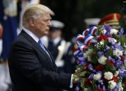 <p>President Trump lays a wreath at the Tomb of the Unknowns at Arlington National Cemetery, May 29, 2017, in Arlington, Va. (Photo: Evan Vucci/AP) </p>