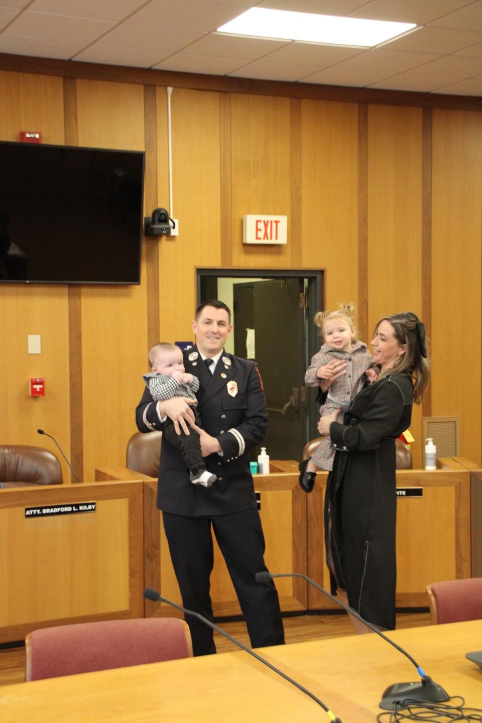 Fall River Fire Department District Chief David Jennings Jr. and his family at the promotion and swearing in ceremony in Fall River Thursday.