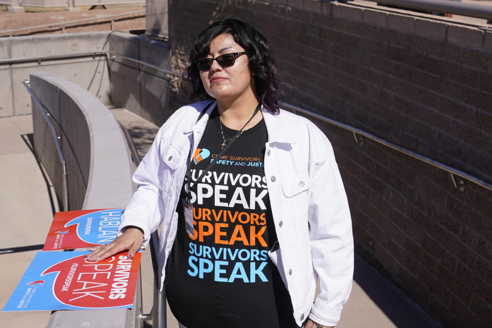 Vanessa Martinez attends a Survivors Speak rally at the Arizona Capitol advocating for a bill to fund a pilot trauma recovery center, Monday, Feb. 27, 2023, in Phoenix. Martinez was denied victim compensation after being shot in the head by her ex-boyfriend because she had unrelated outstanding court fines. (AP Photo/Ross D. Franklin)