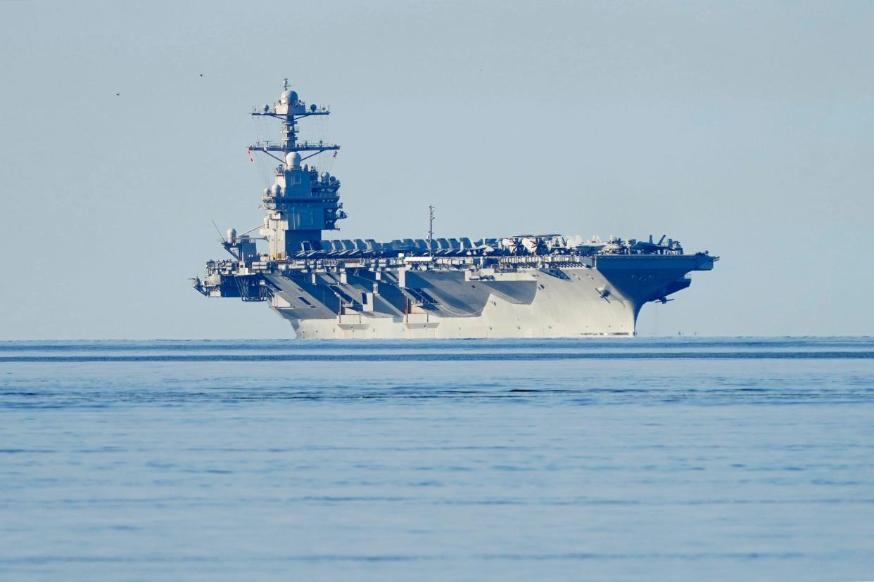 The American aircraft carrier USS Gerald R. Ford on its way into the Oslo Fjord, at Jeløya, Moss, Norway, on Wednesday, May 24, 2023. The ship is the world's largest warship and will be in port in Oslo for four days. (Terje Pedersen/NTB Scanpix via AP)