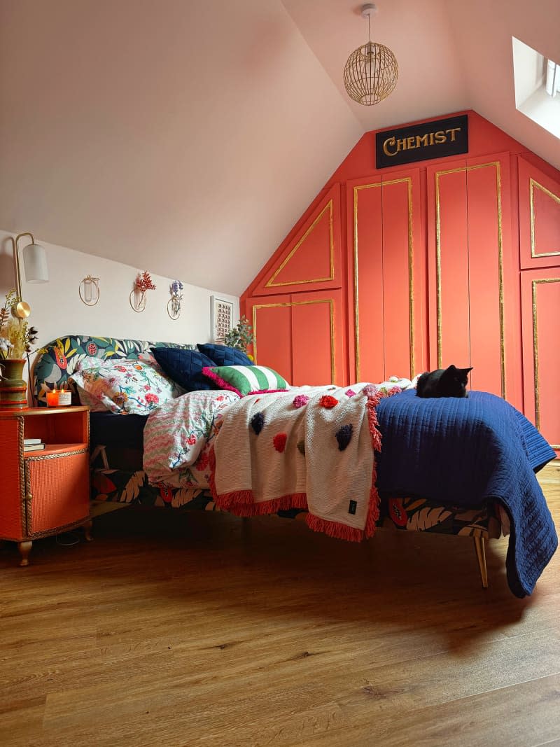 Colorful painted closet walls in bedroom.