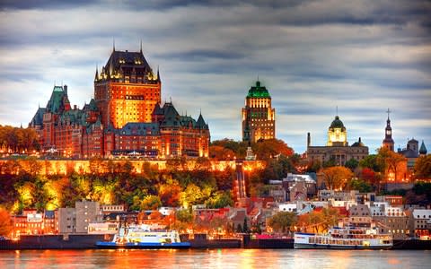 Chateau Frontenac, part of the Quebec skyline, at twilight - Credit: Getty