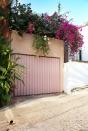 <p><strong>The Style Guide:</strong> How pretty is this blush-pink-painted garage door? Draped by a canopy of bougainvillea, it instantly beautifies the street-front driveway. Take advantage of your vertical space when there's not much you can do about the material used in front of your garage—although, if you look closely, you can see the row of terra-cotta tiles adding a touch of style and personality. </p><p><strong>The Practical Need-to-Know:</strong> There are quite a few variations in municipal regulations for curbside redesign, so you'll definitely need to look into details before getting your heart set on any one style in particular. </p>