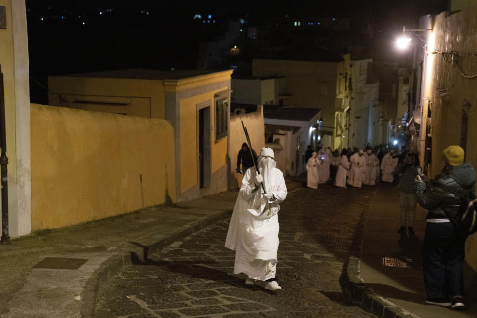 Members of a confraternity carry crosses during a Holy Thursday procession the in Procida Island, Italy, Thursday, March 28, 2024. Italy is known for the religious processions that take over towns big and small when Catholic feast days are celebrated throughout the year. But even in a country where public displays of popular piety are a centuries-old tradition, Procida's Holy Week commemorations stand out. (AP Photo/Alessandra Tarantino)