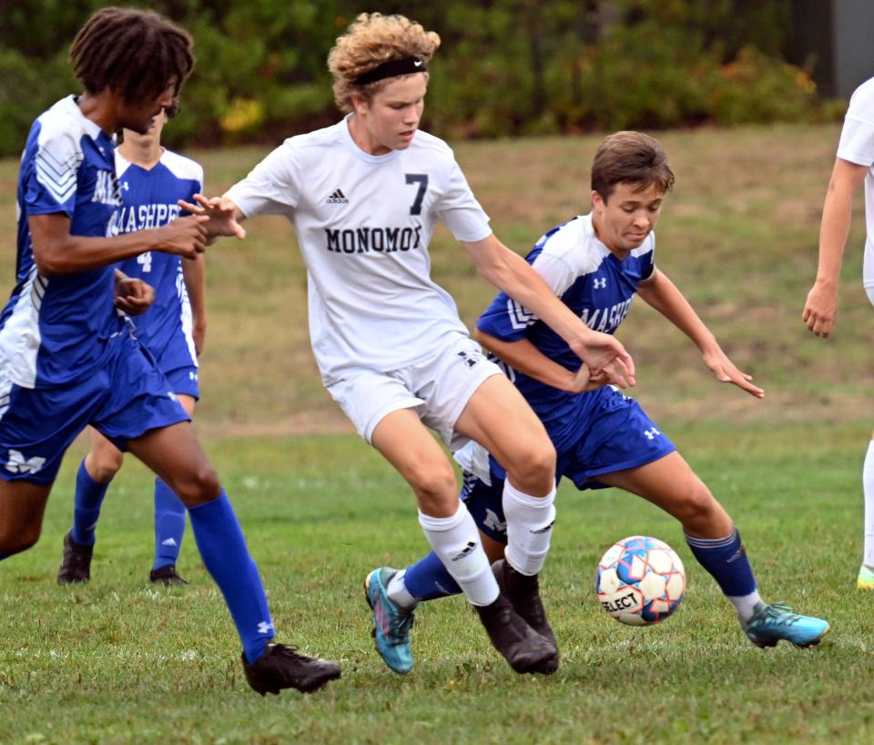 MASHPEE  9/12/22    Ryan Laramee of Monomoy moves between Jack Balfour (right) and Otis Longman of Mashpee