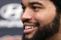 Chicago Bears No. 1 draft pick quarterback Caleb Williams smiles as he listens to reporters during an NFL football news conference in Lake Forest, Ill., Friday, April 26, 2024. (AP Photo/Nam Y. Huh)