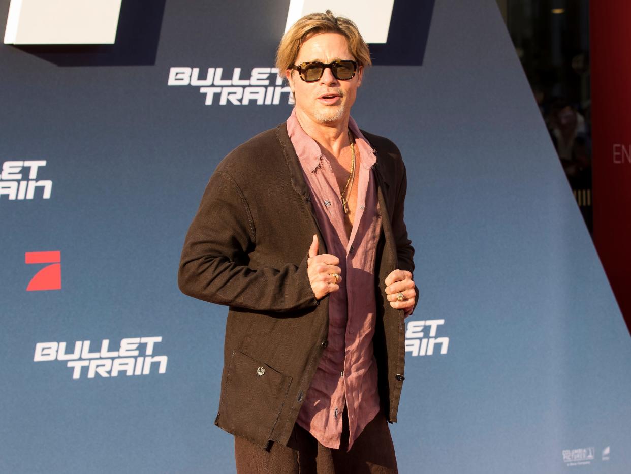 Brad Pitt in a brown skirt at the Bullet Train Premiere.