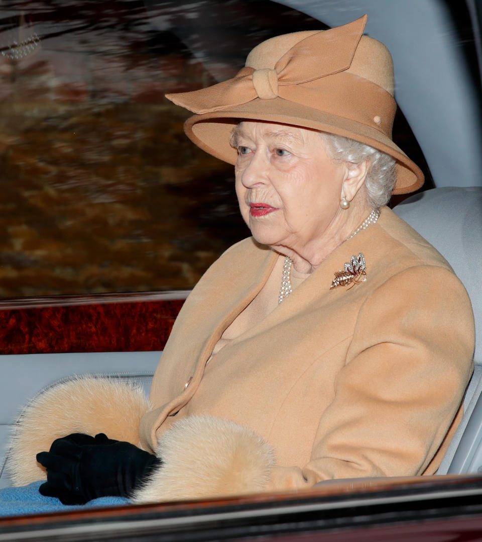 <p>The monarch wore a tan hat and coat and black gloves. Photo: Getty </p>