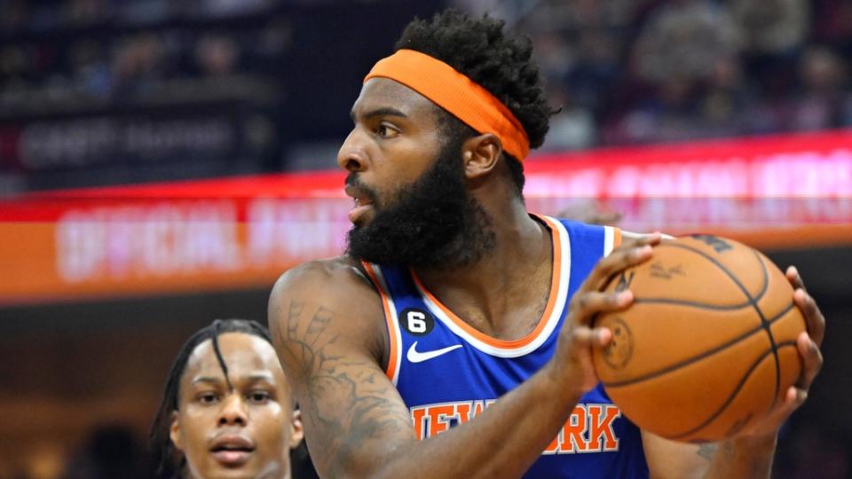 Oct 30, 2022;  Cleveland, Ohio, USA;  Cleveland Cavaliers forward Isaac Okoro (35) defends New York Knicks center Mitchell Robinson (23) in the second quarter at Rocket Mortgage FieldHouse.  Mandatory Credit: David Richard-USA TODAY Sports