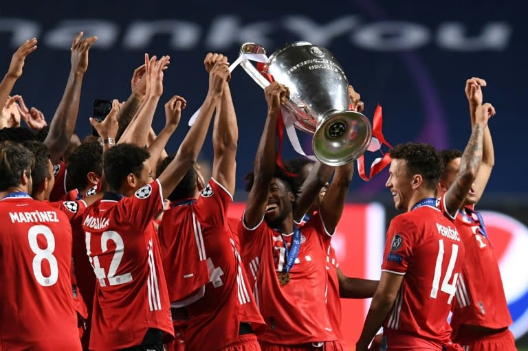 Bayern Munich players raise the Champions League trophy aloft after beating Paris Saint-Germain 1-0 in Sunday's final