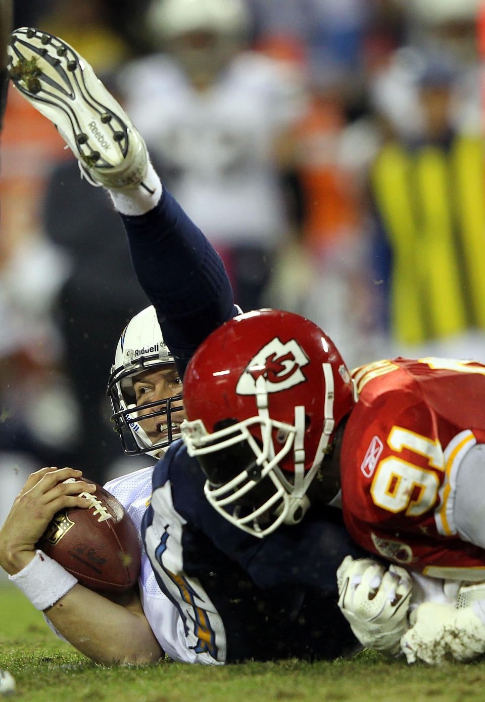 KANSAS CITY, MO - OCTOBER 31: Quarterback Philip Rivers #17 of the San Diego Chargers is sacked by Tamba Hali #91 of the Kansas City Chiefs during the game on October 31, 2011 at Arrowhead Stadium in Kansas City, Missouri. (Photo by Jamie Squire/Getty Images)