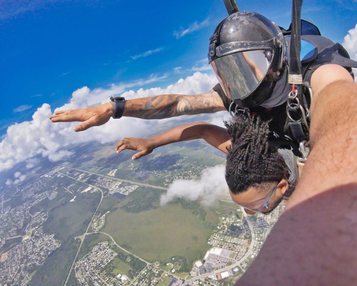person doing tandem skydiving