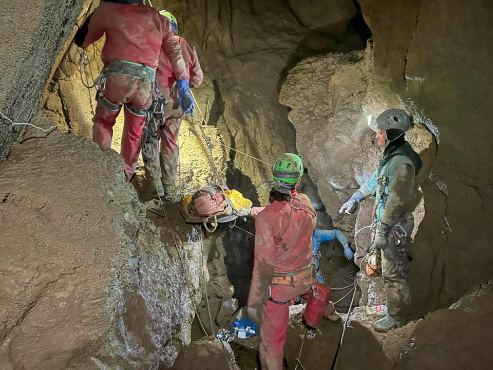 Members of the CNSAS, Italian alpine and speleological rescuers carry a stretcher holding American researcher Mark Dickey during a rescue operation in the Morca cave, near Anamur (AP)