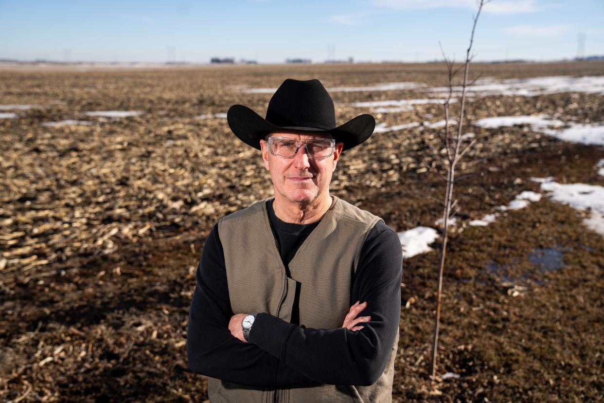 State Rep. Mike Sexton stands on farmland near Rockwell City that's been in his family for around a century.