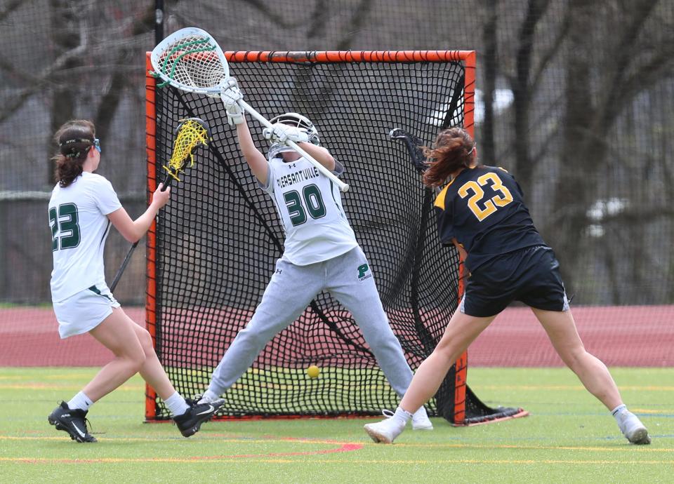 Lakeland/Panas' Clare Warren (23) fires a shot past Pleasantville goalie Ciare McCarthy (30) for a first half goal during girls lacrosse action at Pleasantville High School April 7, 2023. Lakeland/Panas won the game 15-12.  