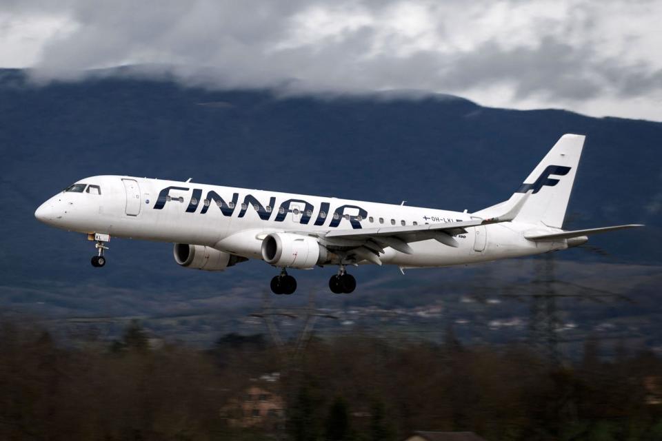 <p>FABRICE COFFRINI/AFP via Getty </p> A Finnair flight lands at Geneva Airport on March 11, 2019