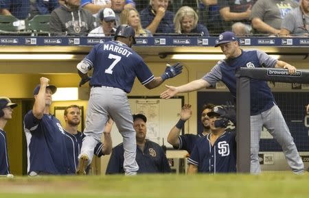 Aug 7, 2018; Milwaukee, WI, USA; San Diego Padres center fielder Manuel Margot (7) celebrates with teammates after hitting a home run during the fifth inning against the Milwaukee Brewers at Miller Park. Mandatory Credit: Jeff Hanisch-USA TODAY Sports