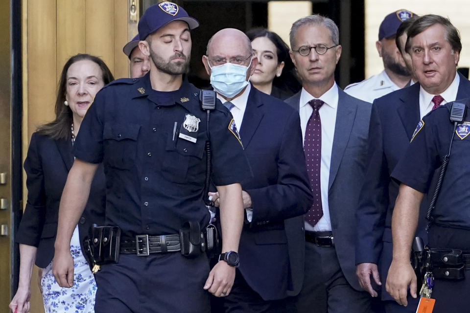 Trump Organization's former Chief Financial Officer Allen Weisselberg, center, leaves court, Thursday, Aug. 18, 2022, in New York. Weisselberg pled guilty on Thursday to tax violations in a deal that would require him to testify about business practices at the former president's company. (AP Photo/John Minchillo)