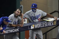 Los Angeles Dodgers starting pitcher Clayton Kershaw in the dugout with first base coach George Lobard after leaving the game during the sixth inning in Game 5 of the baseball World Series against the Tampa Bay Rays Sunday, Oct. 25, 2020, in Arlington, Texas. (AP Photo/Sue Ogrocki)