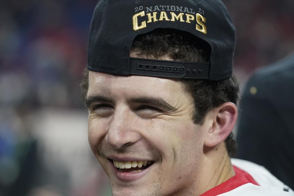 Georgia's Stetson Bennett celebrates after the College Football Playoff championship football game against Alabama Tuesday, Jan. 11, 2022, in Indianapolis. Georgia won 33-18. (AP Photo/Darron Cummings)