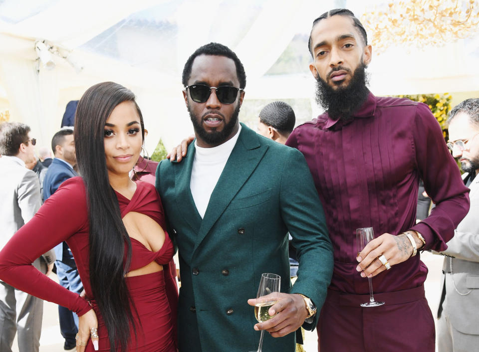 Lauren London (pictured with late partner Nipsey Hussle in February 2019) denied rumors she's now dating Diddy (center). (Photo: Kevin Mazur/Getty Images for Roc Nation)