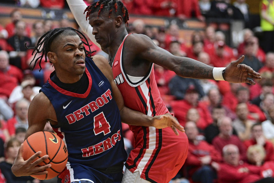 Detroit Mercy guard Marcus Tankersley (4) is pressured by Youngstown State guard Dwayne Cohill, right, during the first half of an NCAA college basketball game in the quarterfinals of the Horizon League tournament, Thursday, March 2, 2023, in Youngstown, Ohio. (AP Photo/David Dermer)