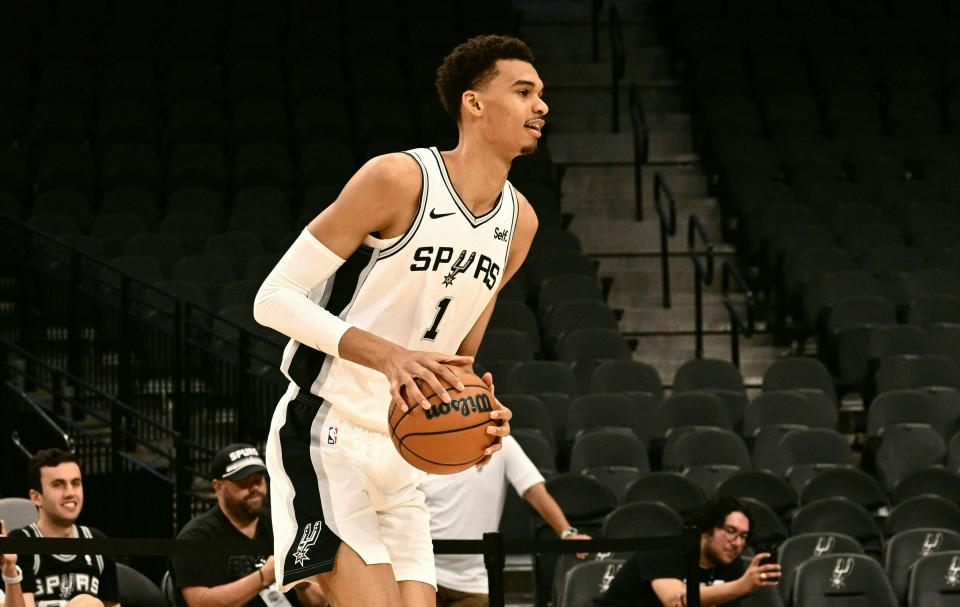 Victor Wembanyama will make his NBA and San Antonio Spurs debut at NBA Summer League in Las Vegas on Friday night against No. 2 pick Brandon Miller and the Charlotte Hornets. (Patrick T. Fallon / AFP via Getty Images)