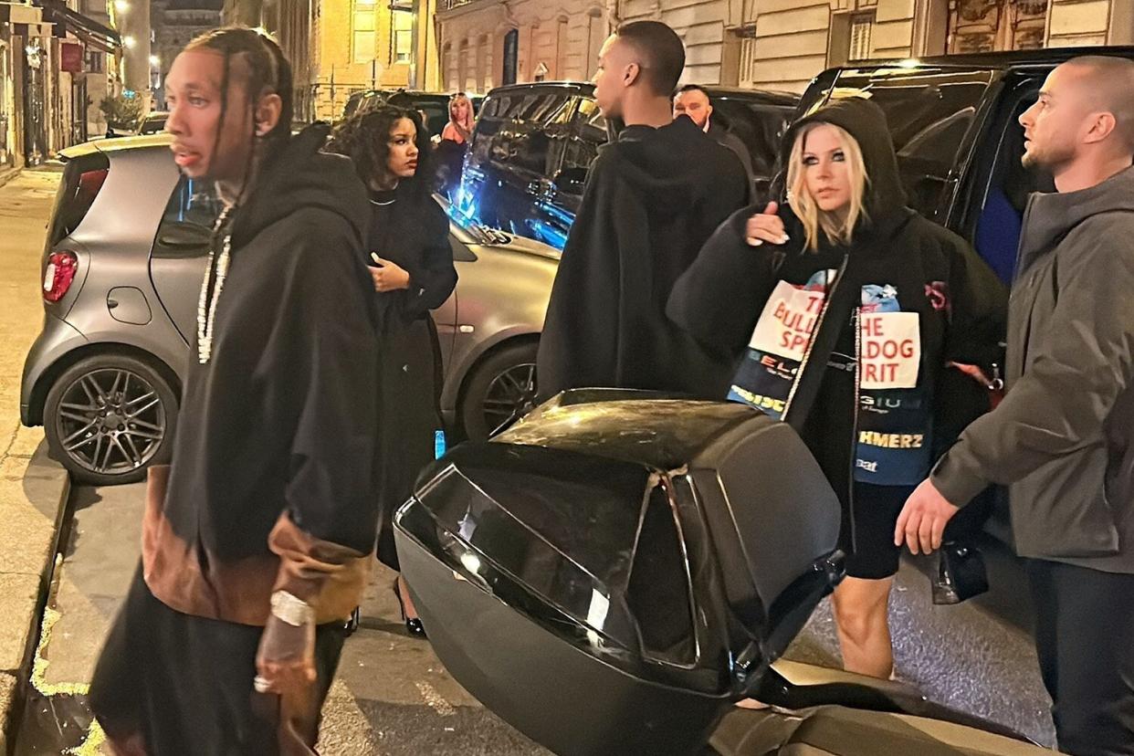 *PREMIUM-EXCLUSIVE* Tyga and Avril Lavigne (who recently separated from her fiancé Mod Sun) are pictured arriving together at Leonardo Dicaprio's party at Kuku restaurant in Paris