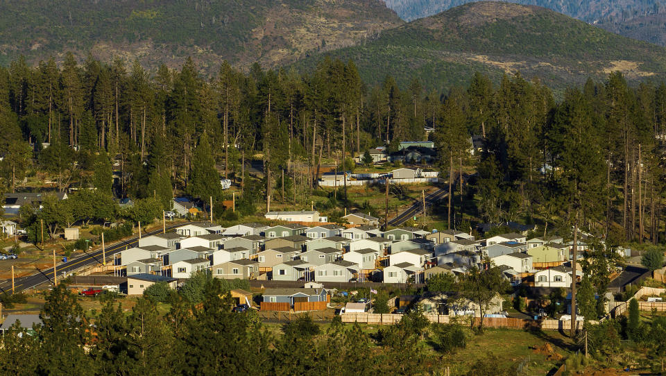 Homes built after the Camp Fire line a hillside at Paradise Mobile Estates, Thursday, Oct. 26, 2023, in Paradise, Calif. (AP Photo/Noah Berger)