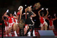 Nicki and Madge pulled out all the stops and went rocked full-blown cheerleader outfits for the 2012 Superbowl. Nicki donned a red and black leather outfit while Madonna vamped it up in all black, adding her signature gloves and thigh-high boots to stand out from the crowd.