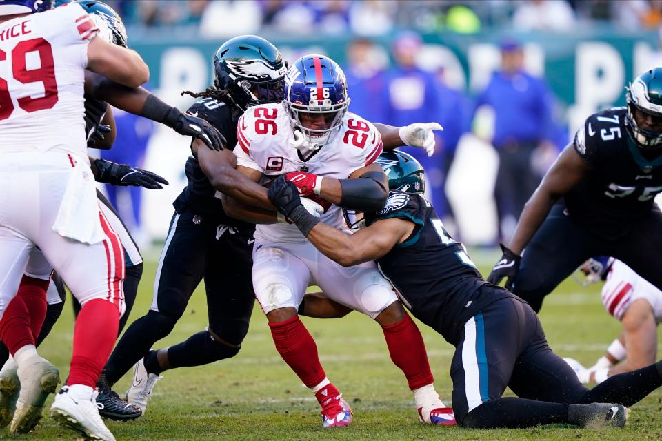 New York Giants' Saquon Barkley runs during the second half of an NFL football game against the Philadelphia Eagles, Sunday, Dec. 26, 2021, in Philadelphia. (AP Photo/Laurence Kesterson)