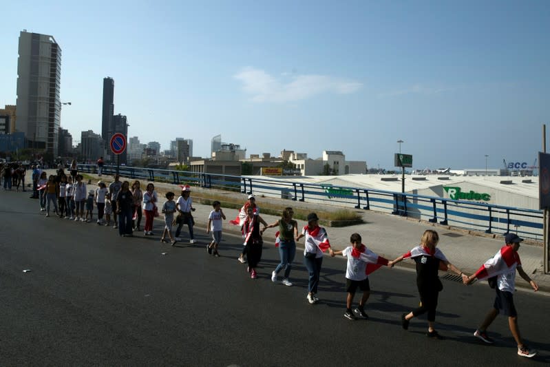 Demonstrators form a human chain during ongoing anti-government protests