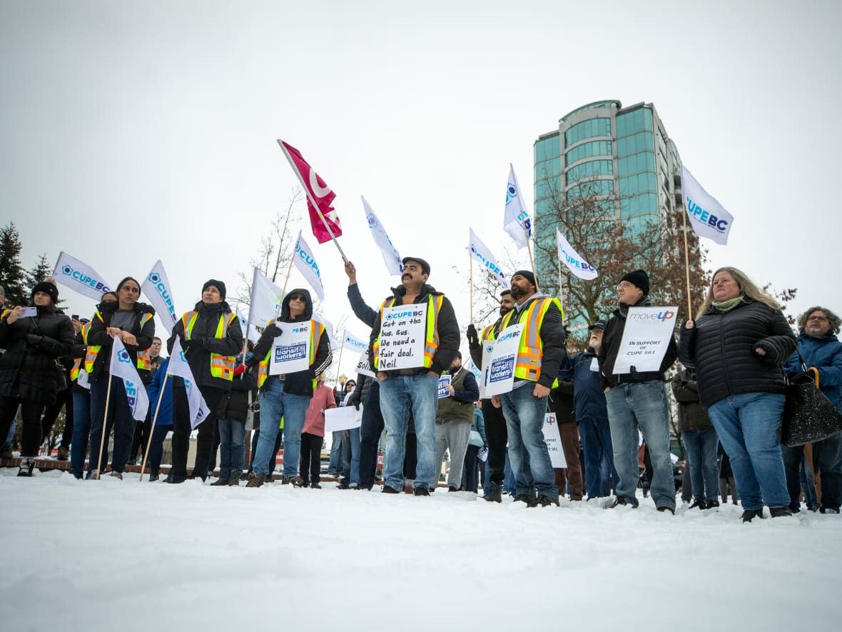 Fraser Valley transit workers gather outside Abbotsford city hall during a rally in late February. (Ben Nelms/CBC - image credit)