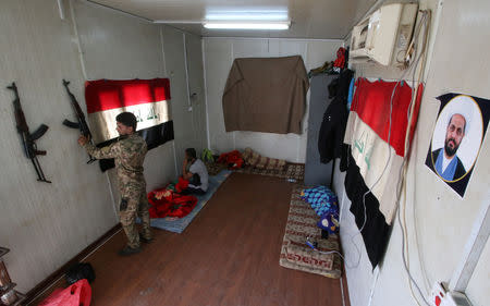 Members of Shi'ite group Asaib ahl al-Haq are seen inside their premises in Basra, Iraq November 8, 2018. Picture taken November 8, 2018. REUTERS/Essam al-Sudani