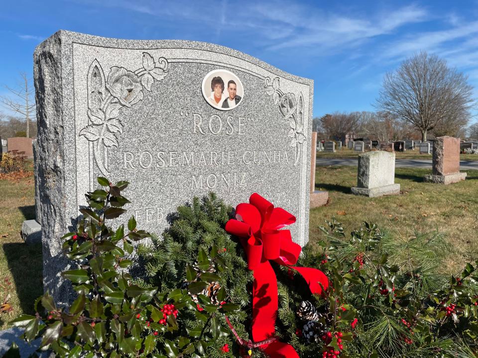 The headstone of Rose Marie Moniz in Pine Grove Cemetery in New Bedford is adorned for the holidays.