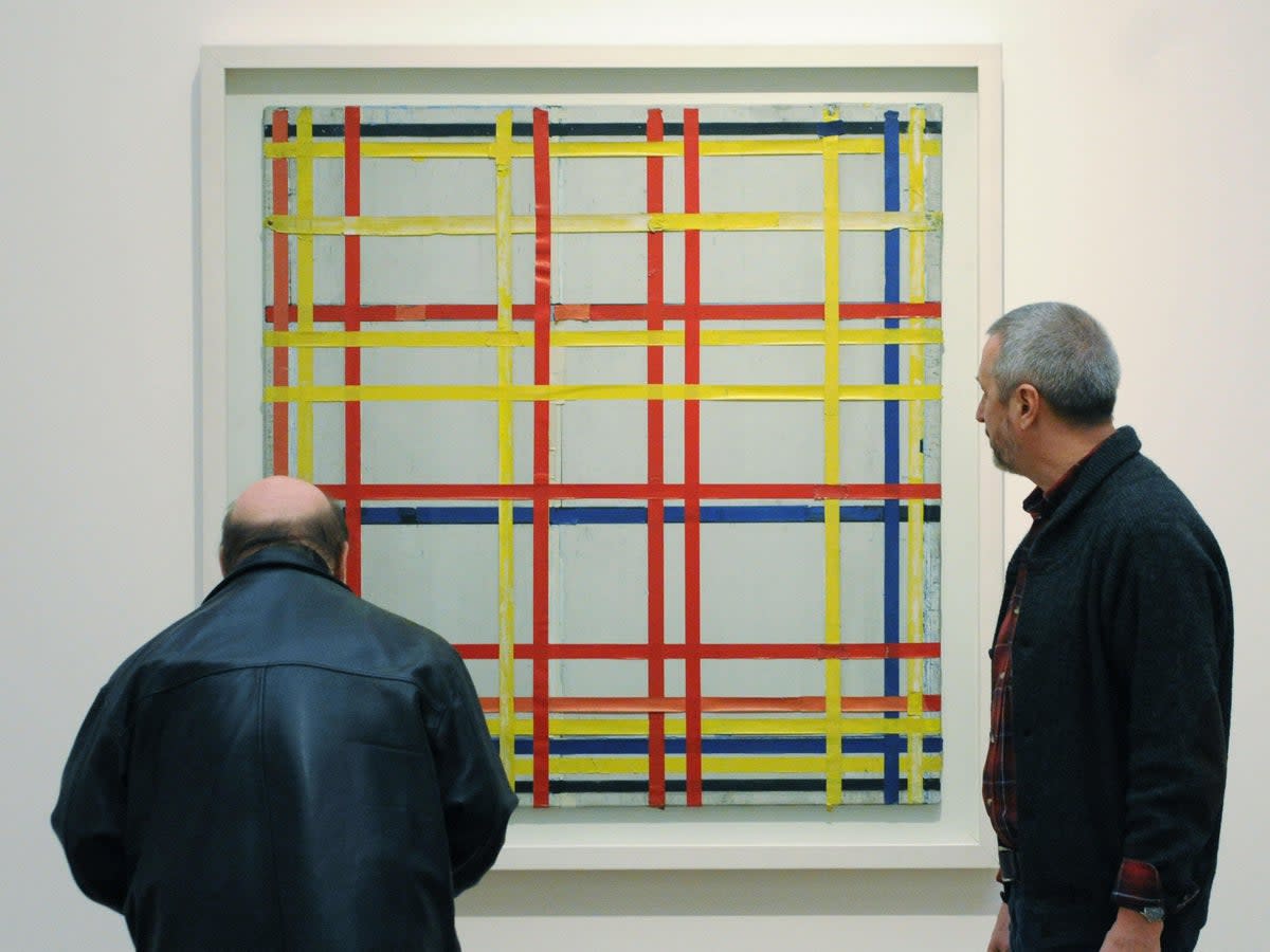 Two visitors look at ‘New York City 1 (unfinished)’ by Piet Mondrian at the Museum Ludwig in Cologne, western Germany (DDP/AFP via Getty Images)