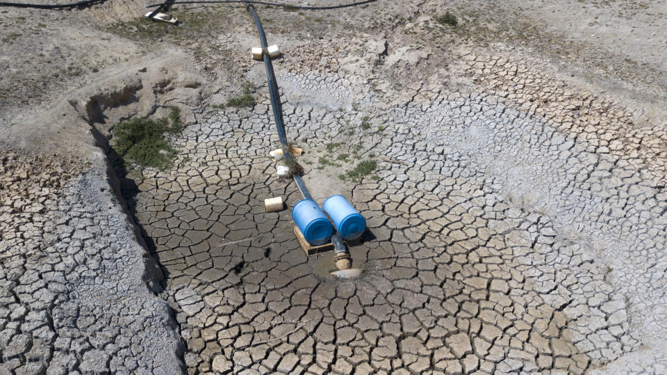 An aerial view of a dried up dam at Cottonvale apple orchard, outside the drought ravaged town of Stanthorpe, Queensland.