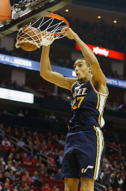 Rudy Gobert takes a break from protecting the rim to punish it. (Scott Halleran/Getty Images)