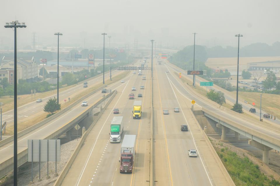 The Peoria skyline is obscured by thick haze Tuesday, June 27, 2023 in a view west towards the city on Interstate 74.