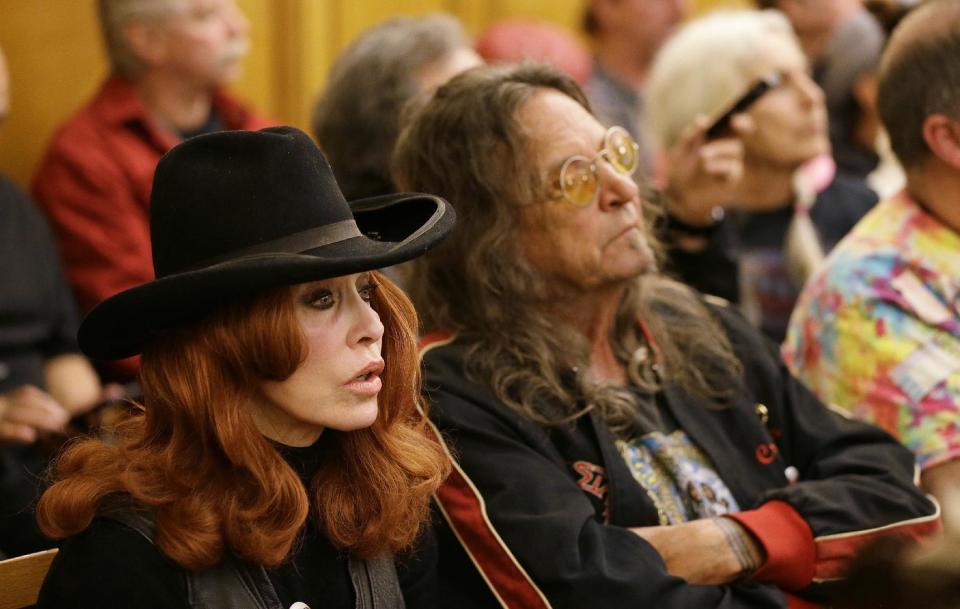 People listen to a commission hearing about a Summer of Love anniversary concert at City Hall Thursday, Feb. 16, 2017, in San Francisco. The show might still go on but a concert planned to mark the 50th anniversary of the Summer of Love has hit another major bureaucratic hurdle. San Francisco's Recreation and Park Commission on Thursday upheld its decision earlier this month to deny a permit for the concert. (AP Photo/Eric Risberg)